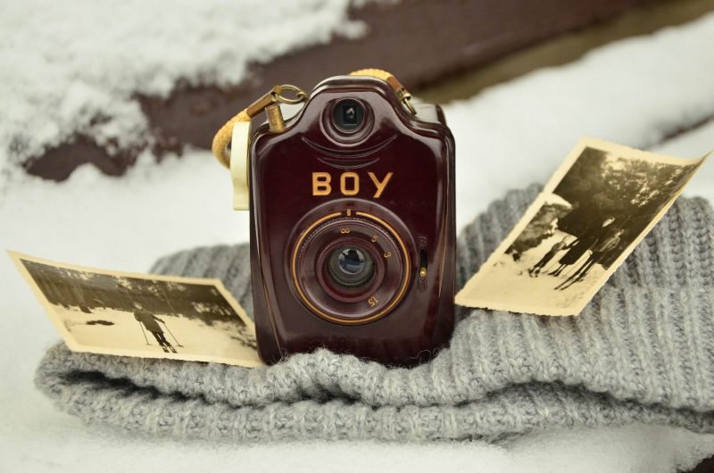 A camera sat on a blanket.