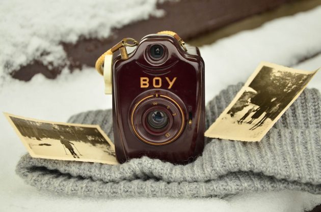 A camera sat on a blanket.