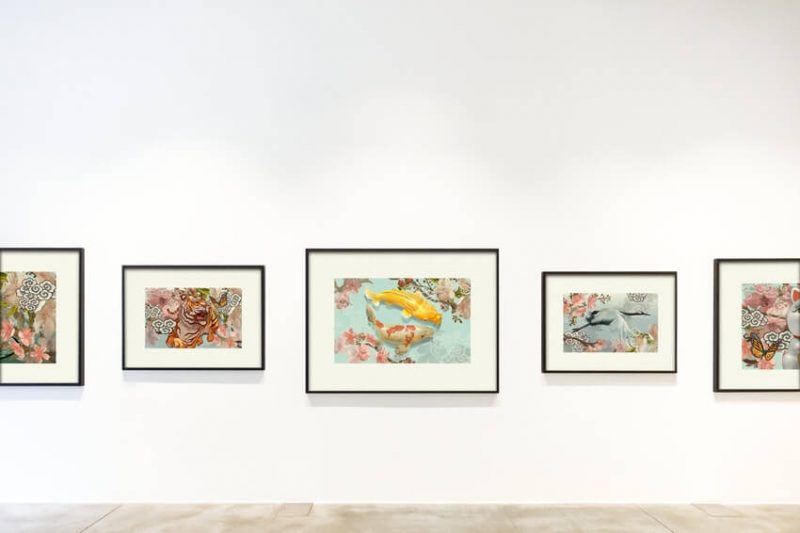 Art pieces hanging in a gallery.