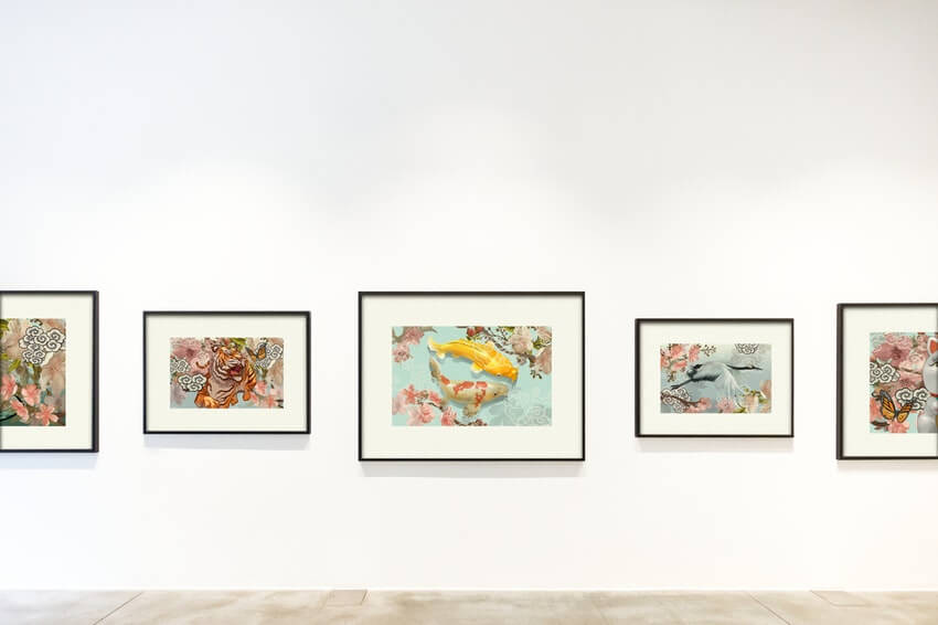 Art pieces hanging in a gallery.