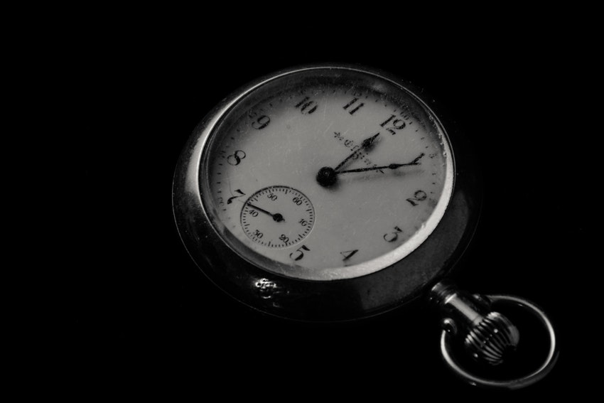 A stopwatch resting on a table.