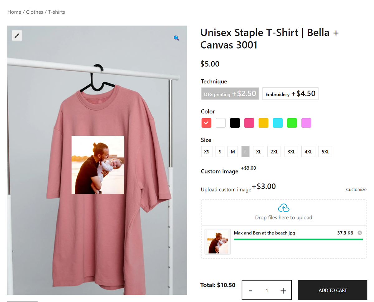 A pink unisex T-shirt on a hanger featuring a custom-printed image of a man embracing a child. The online store interface displays options for printing techniques, shirt colors, sizes, a price, and an option to upload images.